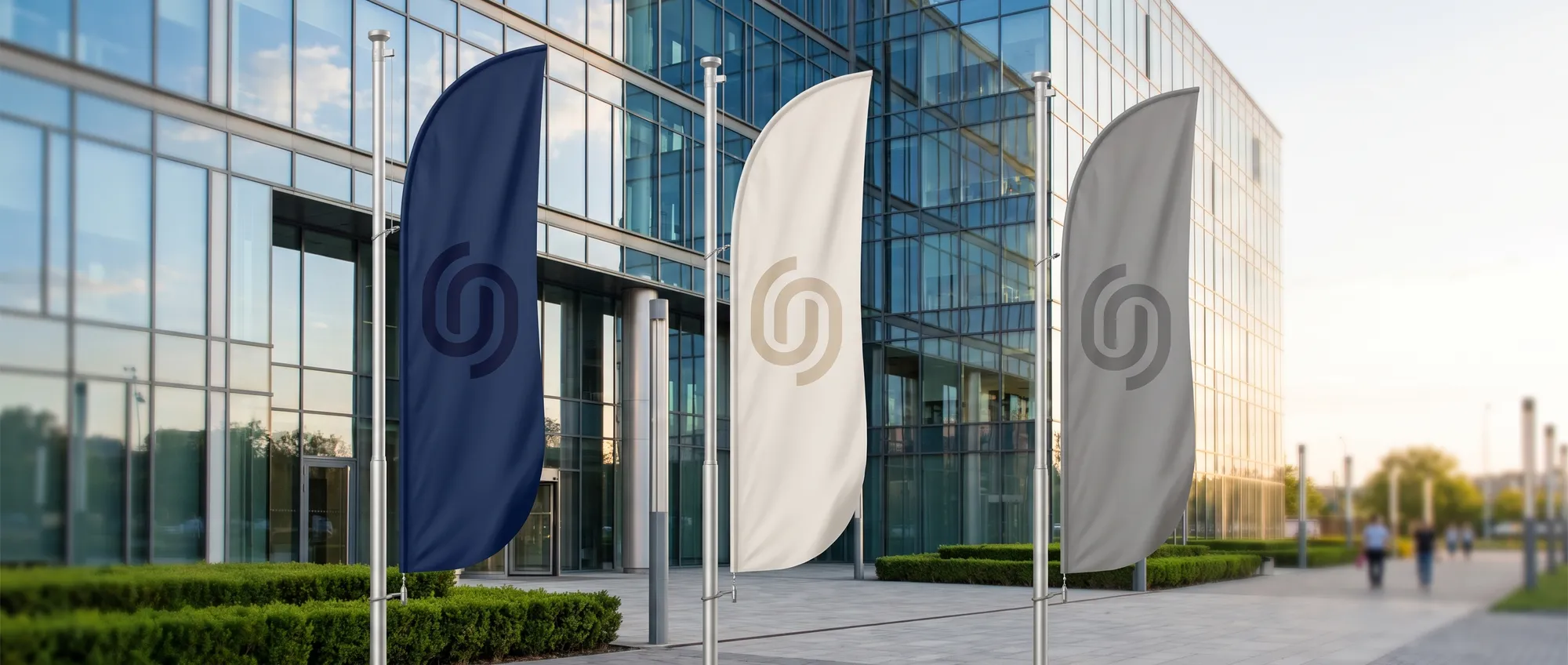 Custom sail flags and banners with a company's logo at the entrance of an event